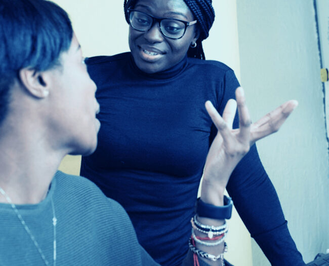 women talking in a office